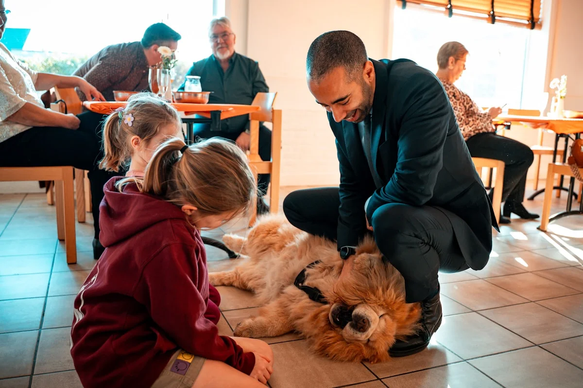 Family enjoying time with their pet at home